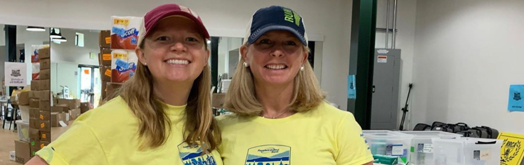 Two women volunteers at marathon Expo.