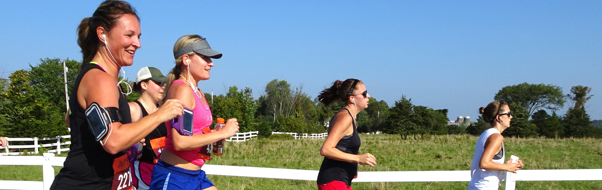 Women running along a field