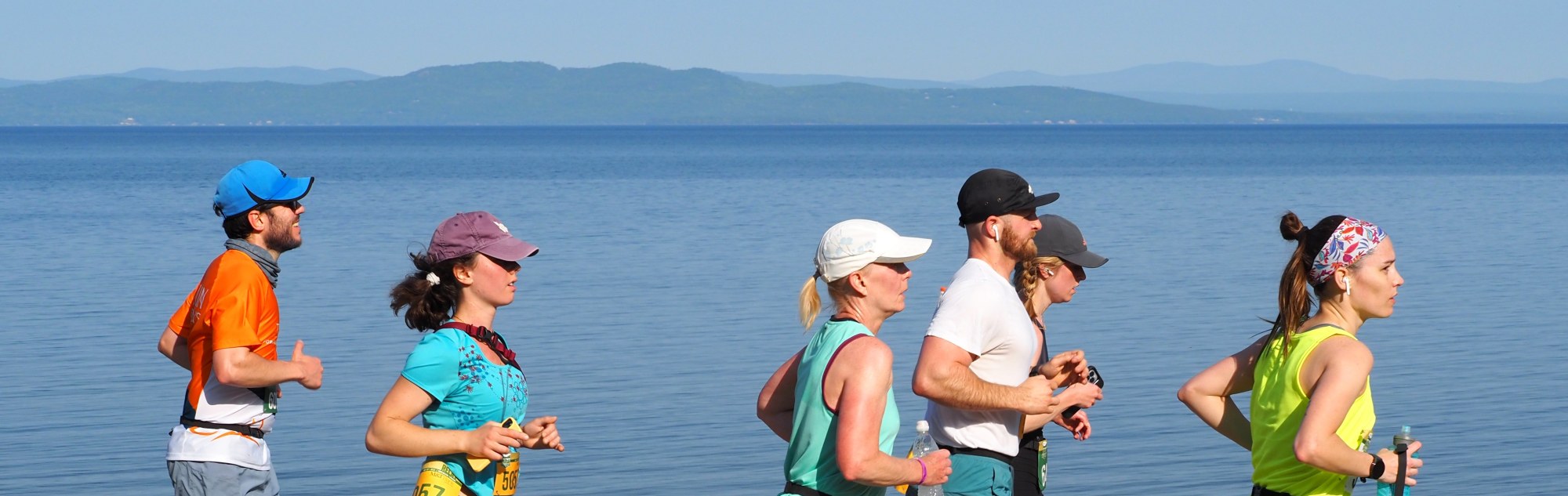 Runners by water